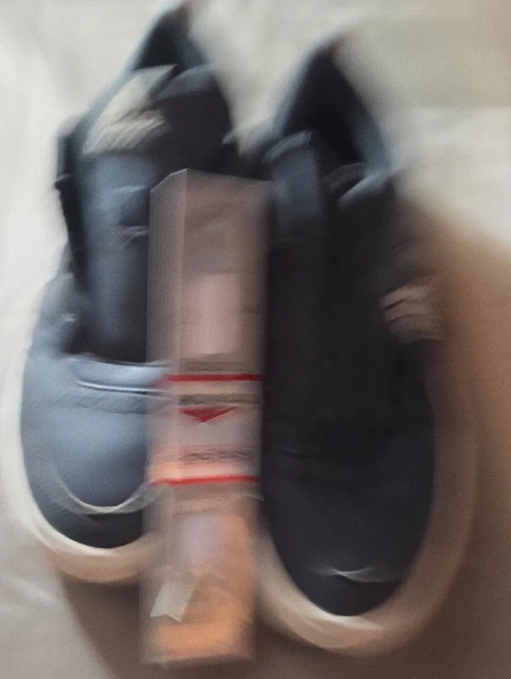 Adidas Black Sneakers with White Soles and Brown Heel Accent